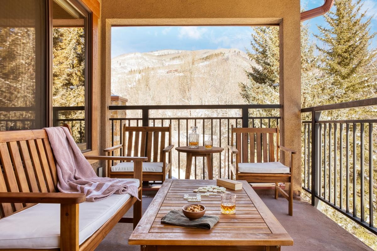 patio with lounge chairs and games outside AvantStay Lions Ridge Vail condo
