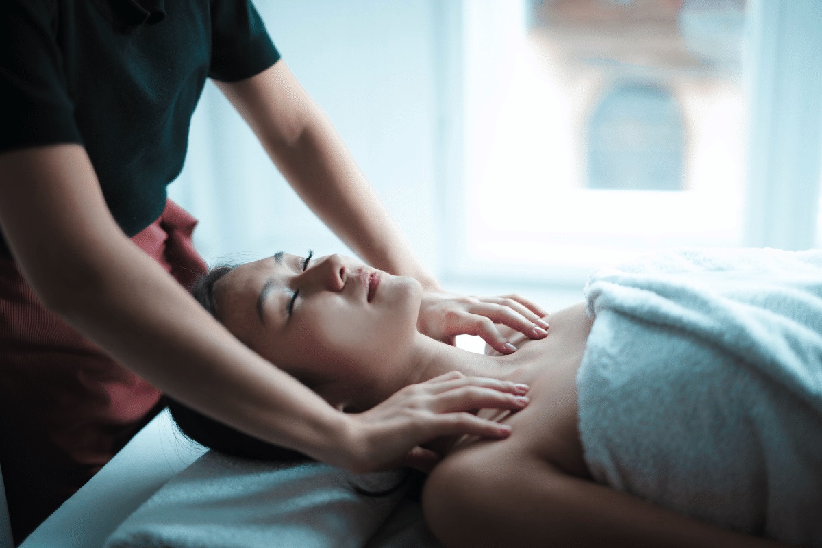 A woman receives a massage at a spa