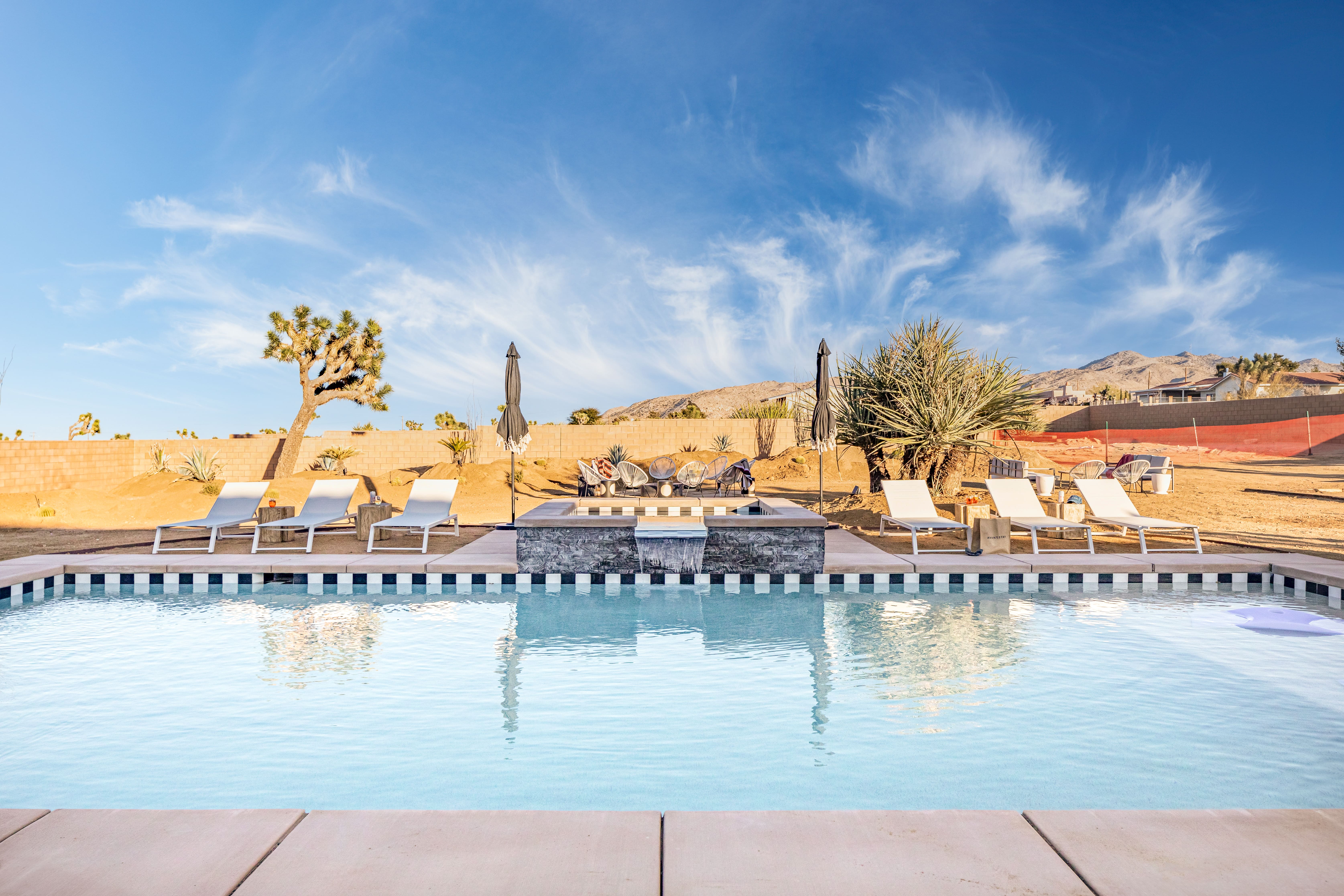 blue swimming pool in an airbnb located at Joshua tree desert